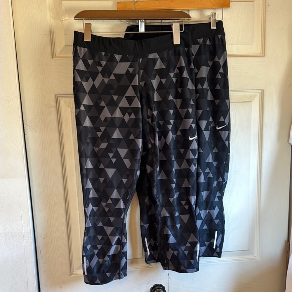 Two pair of women’s Nike Dri-Fit geometric